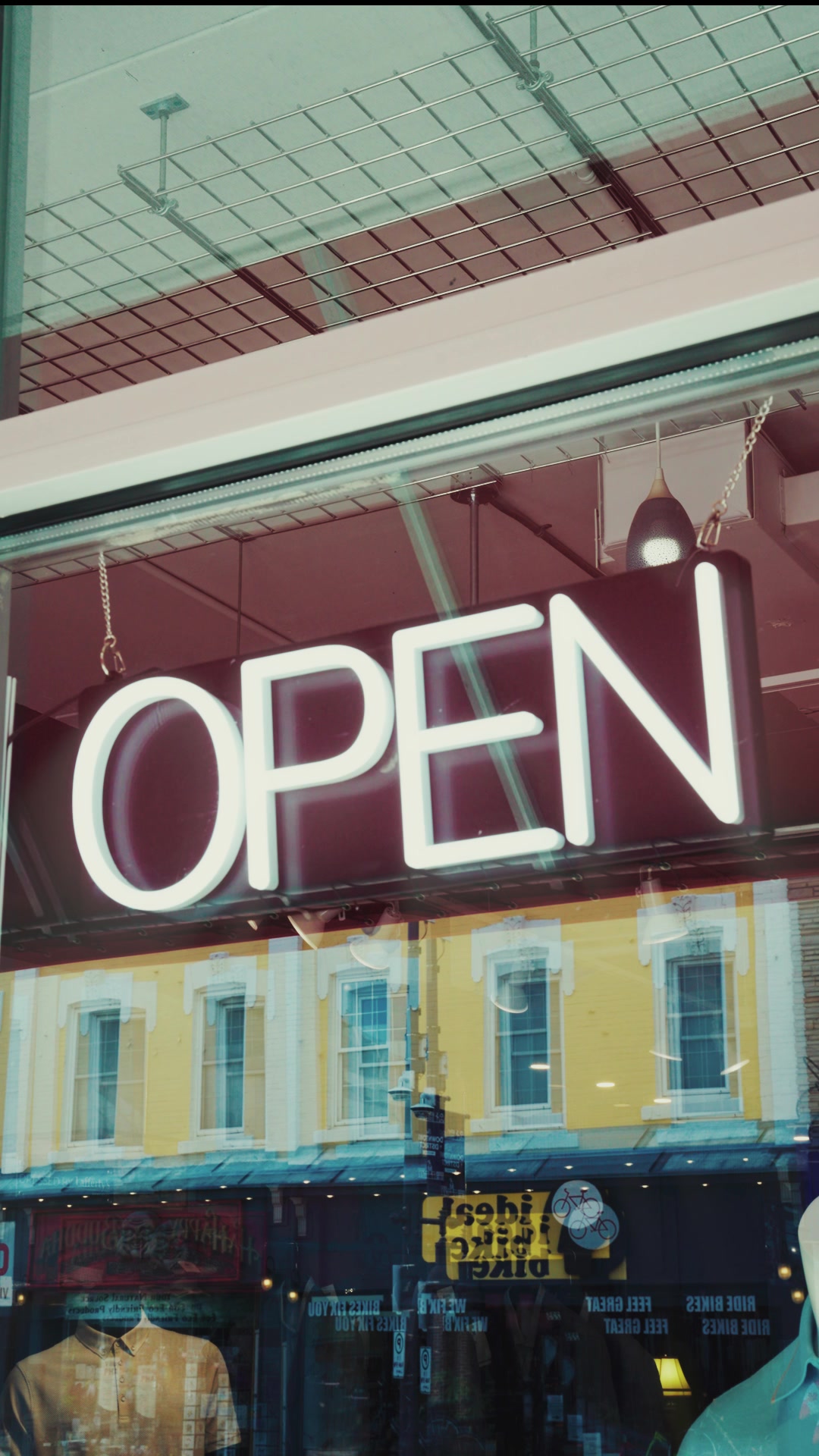 Lafferty's Menswear OPEN sign in the front window on Front Street