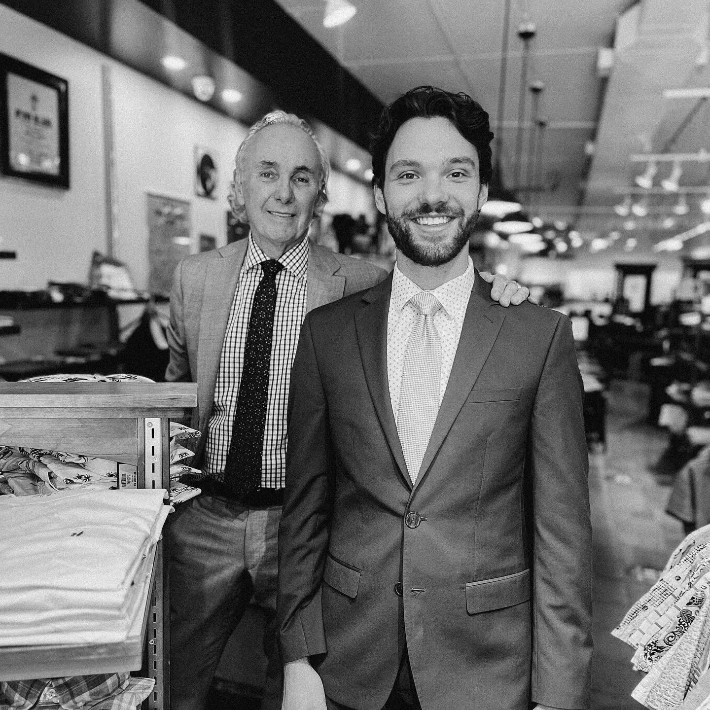Two generations of Lafferty's Menswear on the shop floor