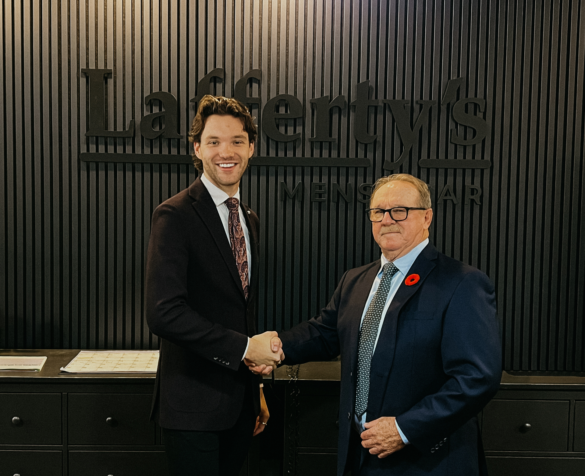 Generations of Lafferty's Menswear — a handshake at the counter