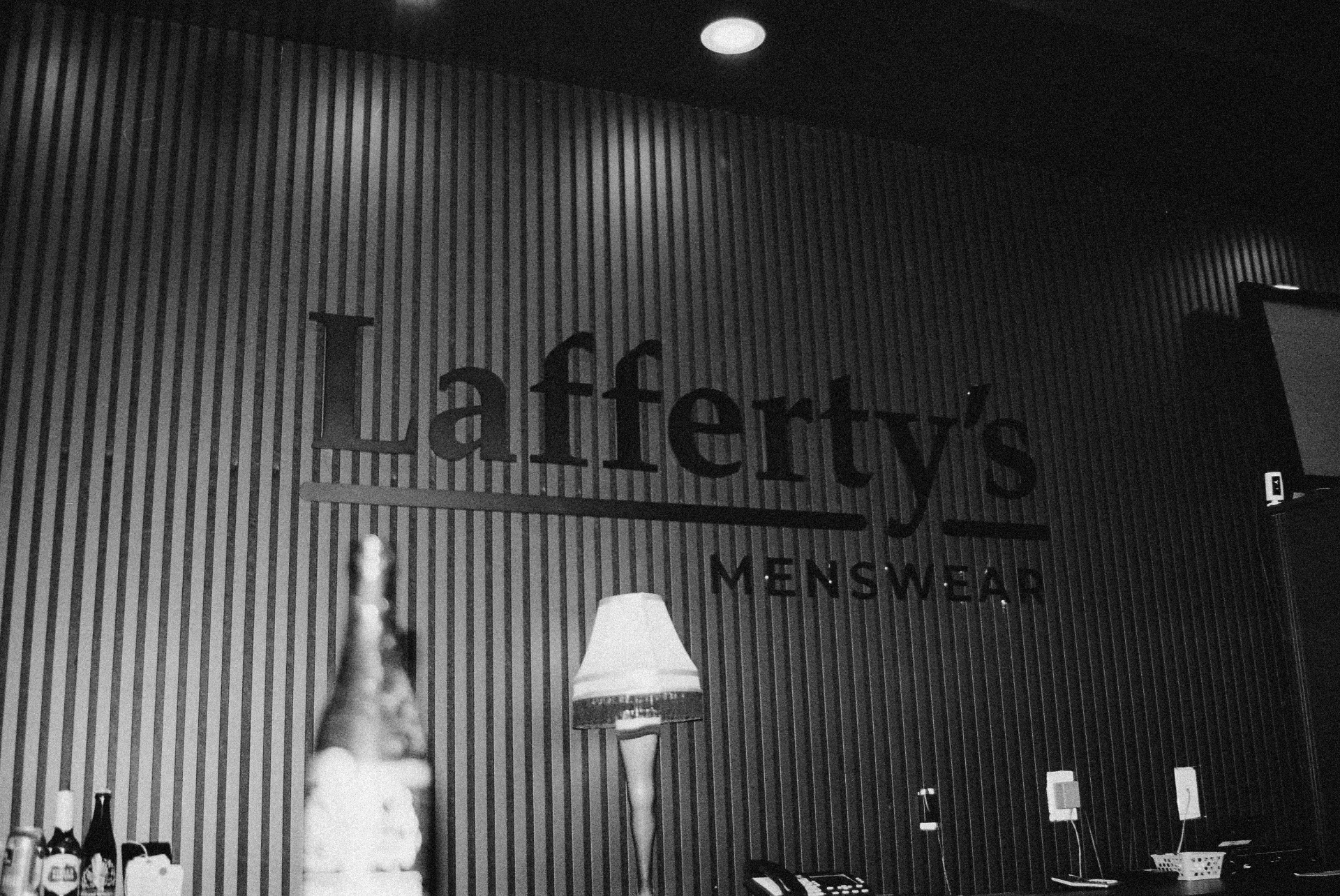 Lafferty's Menswear signage on slatted wood wall